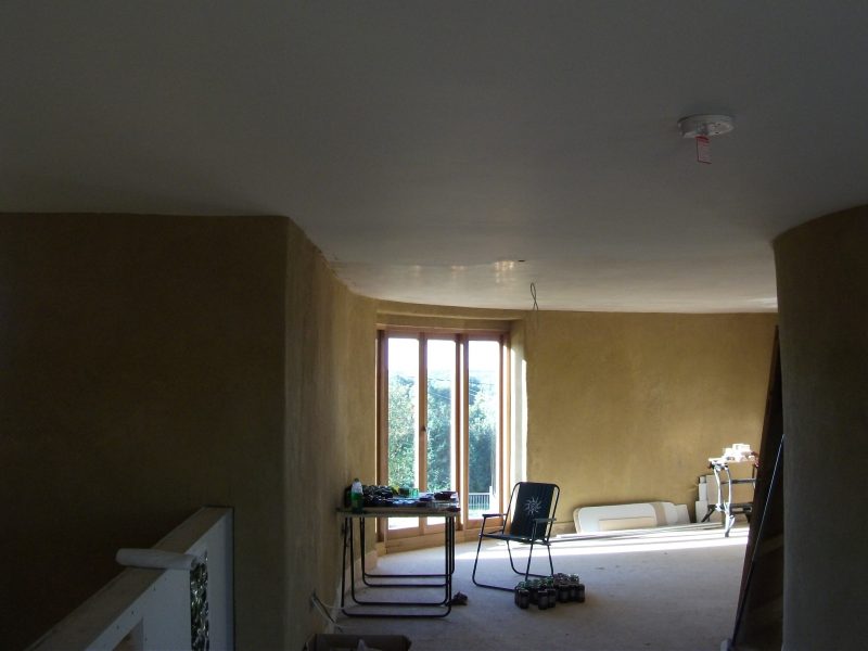 The plasterboard ceiling has been skimmed with plaster in this straw bale house, which was featured on the Channel 4 series, Building the Dream.