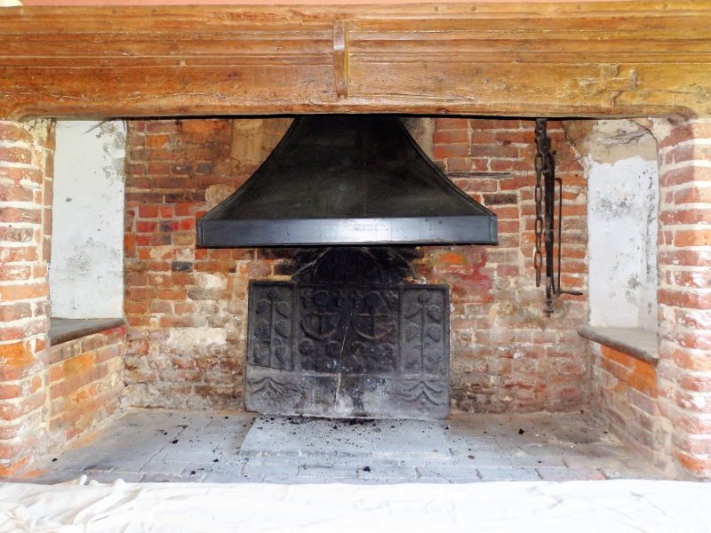 17th Century Brick Ingleknook fireplace, before being lime pointed