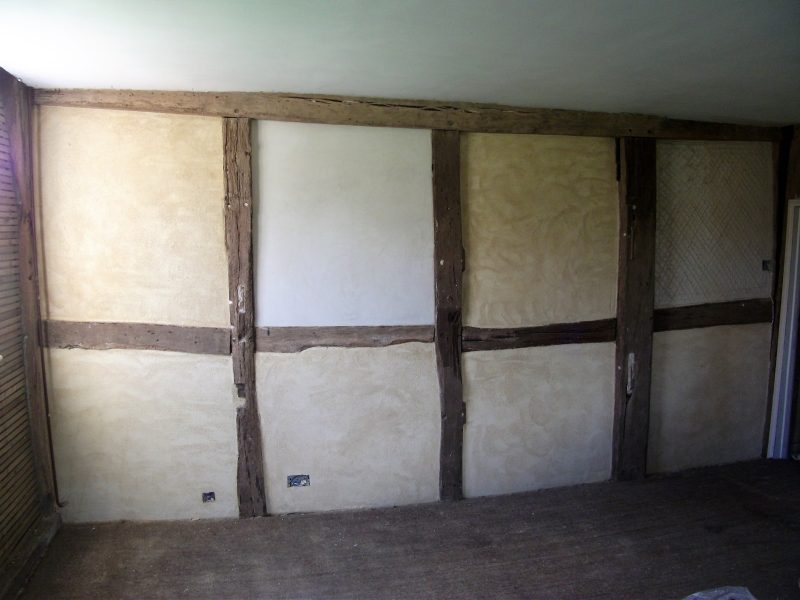 Lime plaster repairs to a timber framed wall. After. 2013