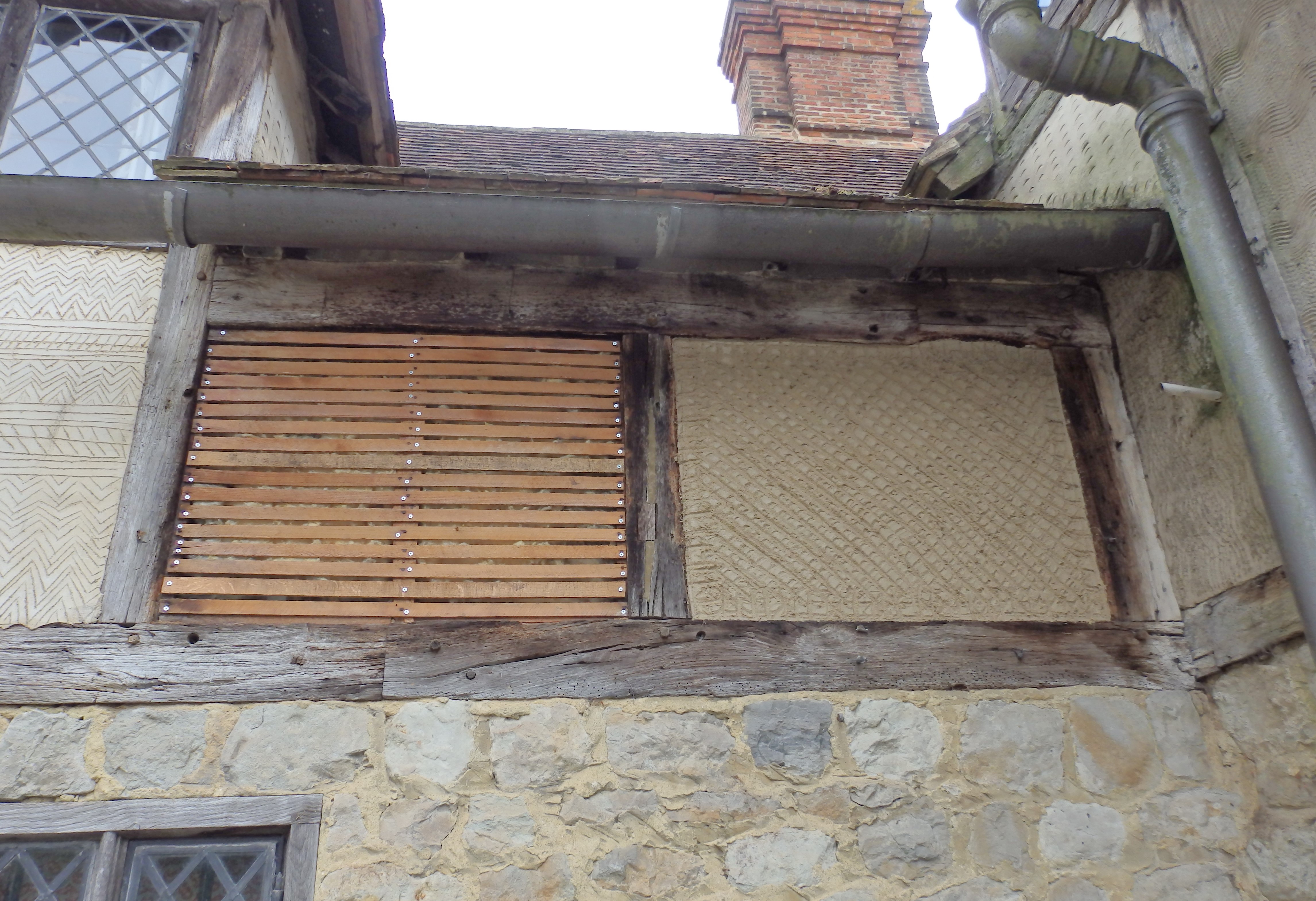Otham Manor. A Grade 1 listed property, dating around 1370. Laths repaired, and first coat of lime plaster being applied.